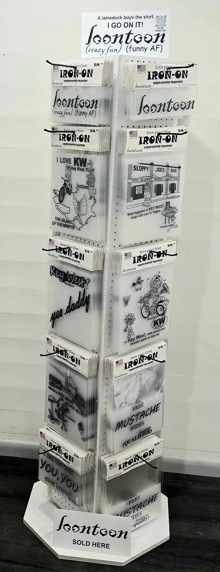 The loontoon rotating display stand, loaded with packaged iron-on transfers